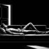 Black and white image of a man lying awake on a couch in a dark room, unable to sleep
